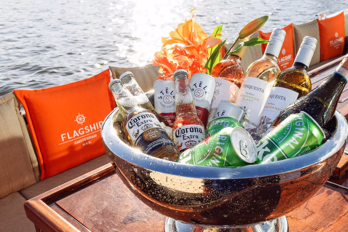 An ice bucket filled with drinks is ready for guests on an Amsterdam canal cruise.